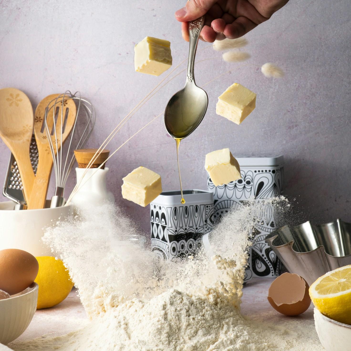 Community members collaborating in a modern kitchen space, sharing recipes and cooking techniques